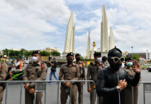 Leaked Plan Shows Police Preparing to Defend Royal Grounds Police stand guard at the Democracy Monument on Aug. 16, 2020.