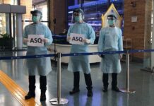 ‘Phuket Model’ Expanded Nationwide Despite Little Support Phuket airport staff test a temperature screening device on Sept. 8, 2020, in anticipation of a partial reopening for tourism.