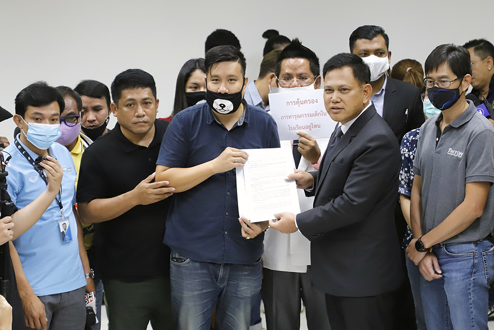 Parents submit a petition to Prayut Petchkhun, spokesman of the Office of the Attorney General, on Oct. 5, 2020.