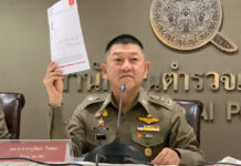 Real or Fake? Cops Show Interpol Notice for ‘Boss Red Bull’ Lt. Gen. Jaruwat Waisaya shows what he said to be a copy of the Interpol Red Notice for Vorayuth “Boss” Yoovidhya during a press conference on Oct. 7, 2020.