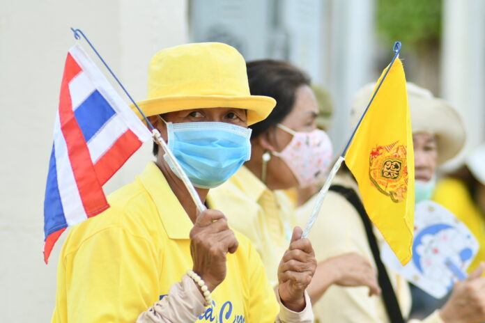 A pro-establishment supporter near the Democracy Monument on Oct. 14, 2020.