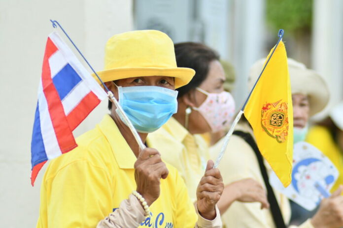 A pro-establishment supporter near the Democracy Monument on Oct. 14, 2020.