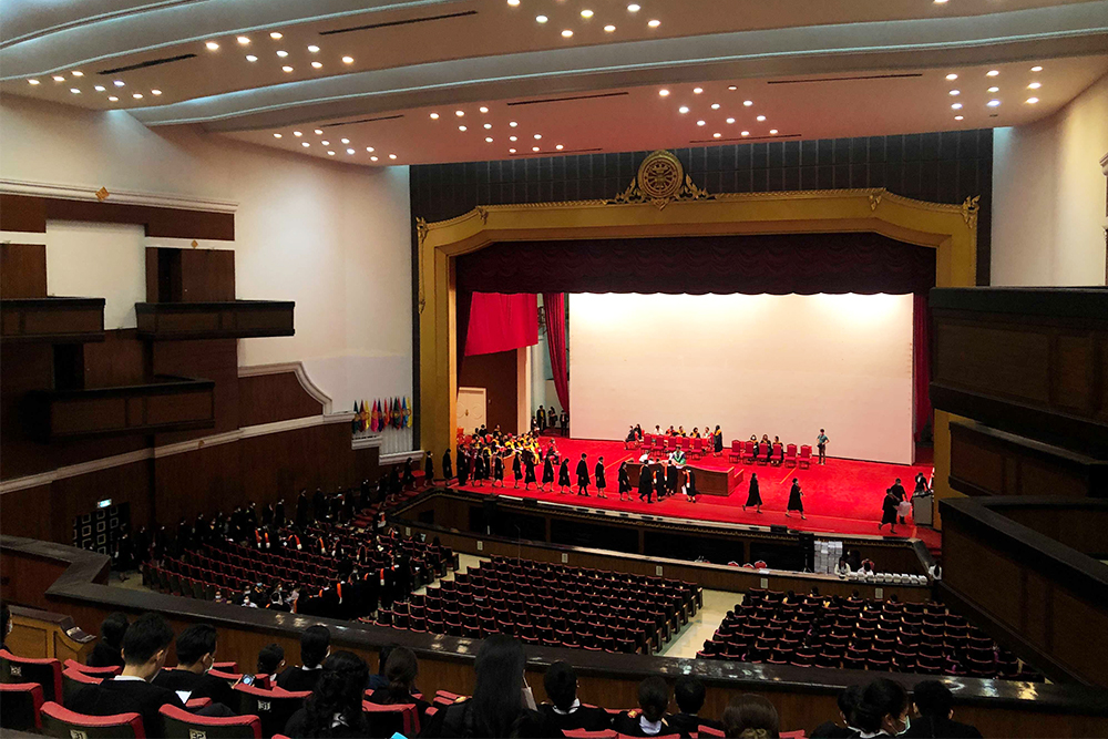 Graduates take part in a dress rehearsal inside the Thammasat University Auditorium on Oct. 24, 2020.