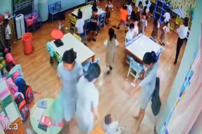 A screenshot of security camera footage released by the child's parent shows the alleged assault.