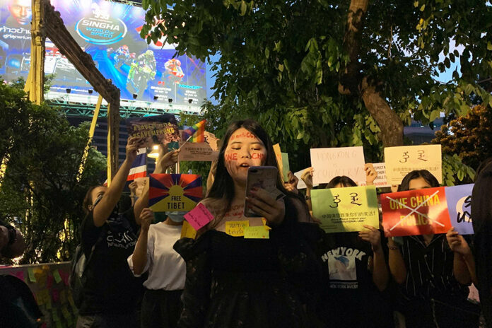 Activist Napassorn Saengduean reads out a statement during the protest on Oct. 1, 2020.