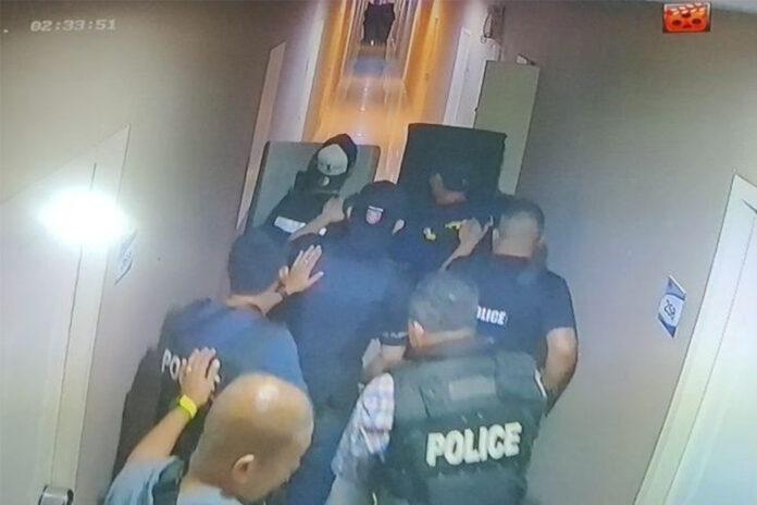 A still from security camera footage shows police commandos approaching the suspect’s condominium room on Nov. 3, 2020.