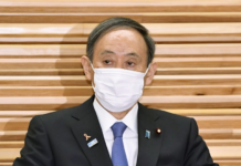 Japan PM Defends Travel Subsidy Program Amid Virus Resurgence