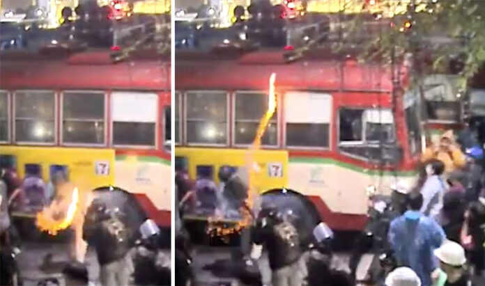Screenshots of a protester throwing a smoke bomb at police on Nov. 9, 2020. Photo: Shibushix / Twitter