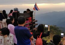 No Refunds For Year-End Trips Under Travel Subsidy Program Visitors take photos of the sunrise in Suphanburi province on Dec. 12, 2020.