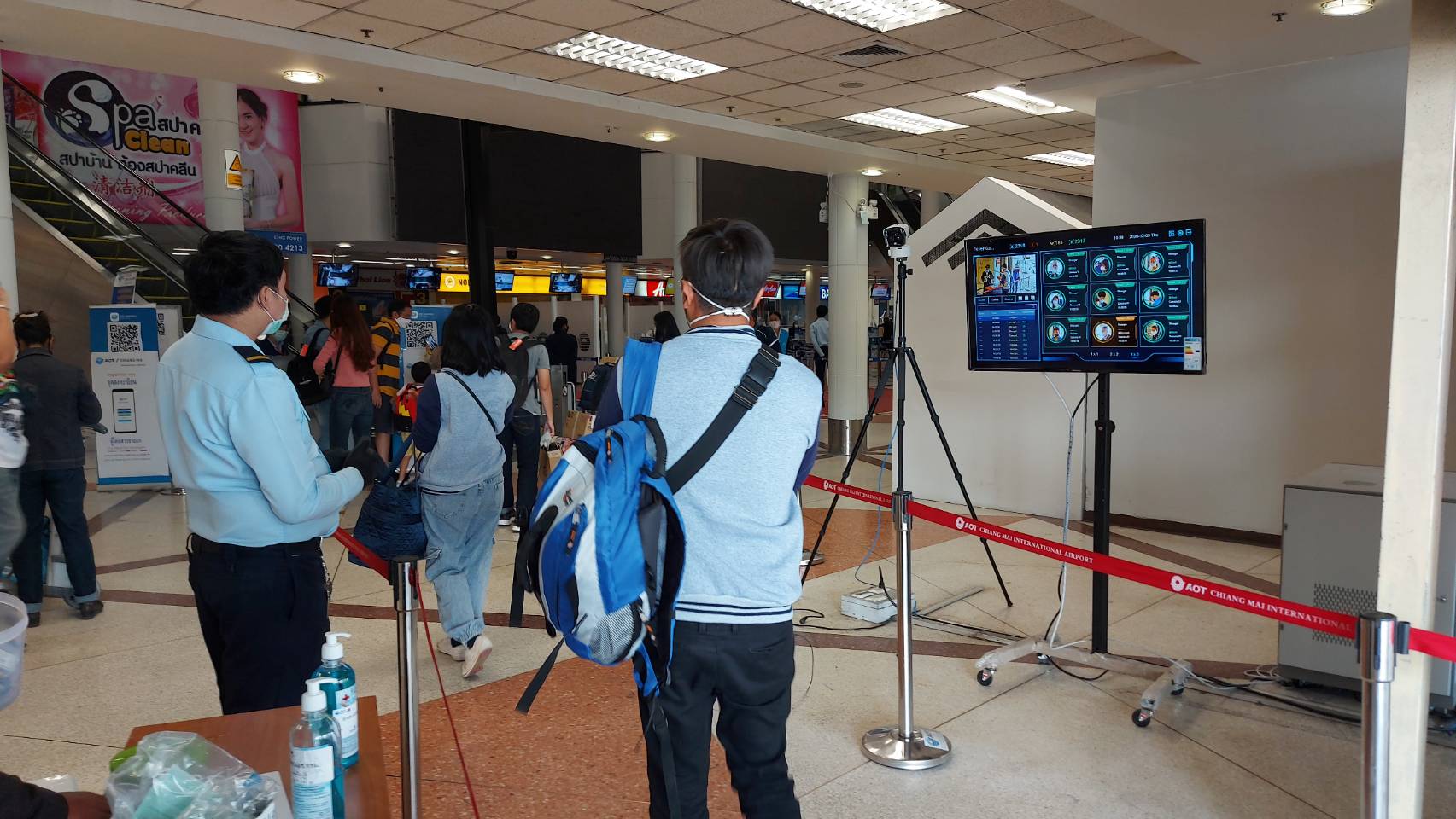 Passengers get their temperature checked at Chiang Mai Airport.
