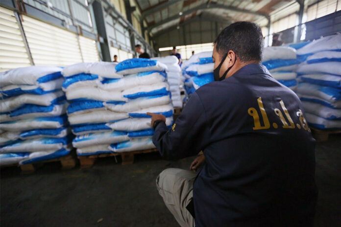 An agent from the Office of the Narcotics Control Board inspects piles of sacks believed to be containing ketamine during a raid of a warehouse in Chachoengsao province on Nov. 12, 2020. An agent from the Office of the Narcotics Control Board inspects piles of sacks believed to be containing ketamine during a raid of a warehouse in Chachoengsao province on Nov. 12, 2020.