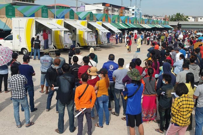 People line up to take COVID-19 test in Samut Sakhon province on Dec. 23, 2020.