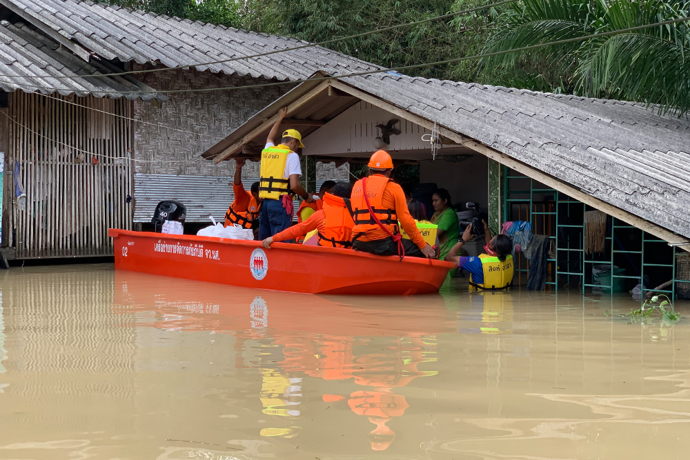 Rescue workers deliver supplies to residents affected by flooding in Nakhon Si Thammarat province on Dec. 4, 2020.