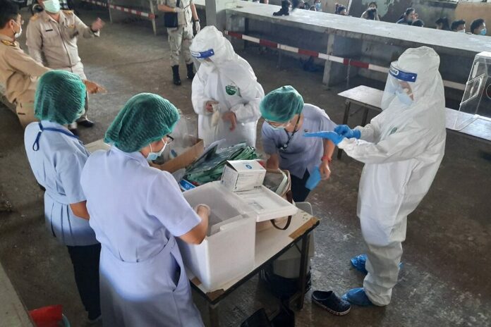 Health workers prepare test kits in Nonthaburi on Dec. 22, 2020.