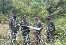 Anutin: ‘Selfish’ Returnees Pose Risk Of Renewed Outbreak Security officers patrol the Thai-Myanmar border in Prachuap Khiri Khan province on Dec. 3, 2020.