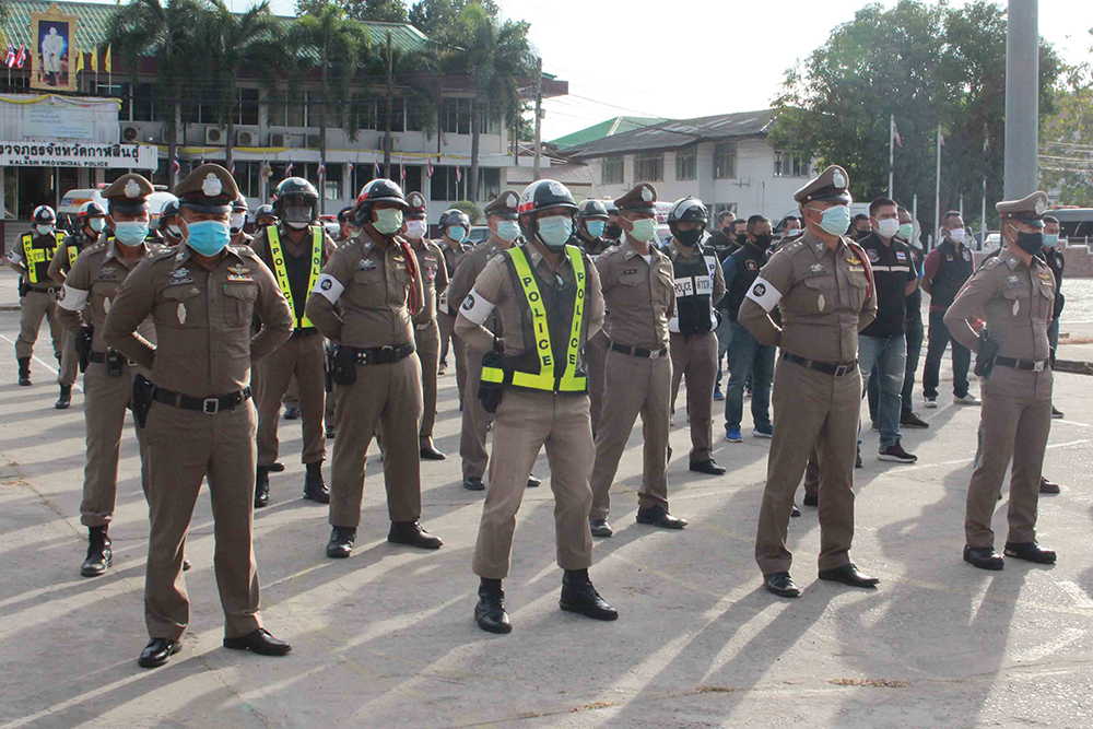 Police in Kalasin province stand at attention as they wait to be deployed on Dec. 25, 2020.