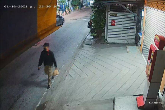 A screenshot of a CCTV footage released by police shows a man investigators said to be Mongkol Santimethakul walking down the street near his residence on Jan. 16, 2021. A screenshot of a CCTV footage released by police shows a man investigators said to be Mongkol Santimethakul walking down the street near his residence on Jan. 16, 2021.