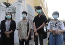 3 High School Activists Indicted for Staging Anti-Gov’t Rally Khanaphot Yaemsanguansak, second from left, Laponpat Wangpaisit, and Benjamaporn Nivas at the Office of the Attorney General on Jan. 28, 2021.