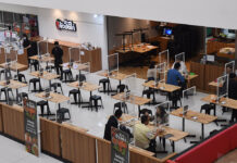 Bangkok Dine-In Hours To Be Extended, But Bars Won’t Reopen Diners at a restaurant in Bangkok eat within plastic partitions set up to maintain social distancing on Jan. 28, 2021.