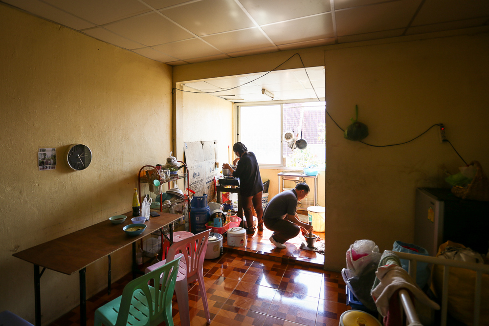 James’ parents prepare lunch in their home north of Bangkok.