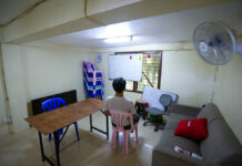 ‘We Never Know What Tomorrow Brings:’ COVID Strands Thousands of Refugees in Thailand James sits in the living room, which regularly hosts English lessons for children in the community.