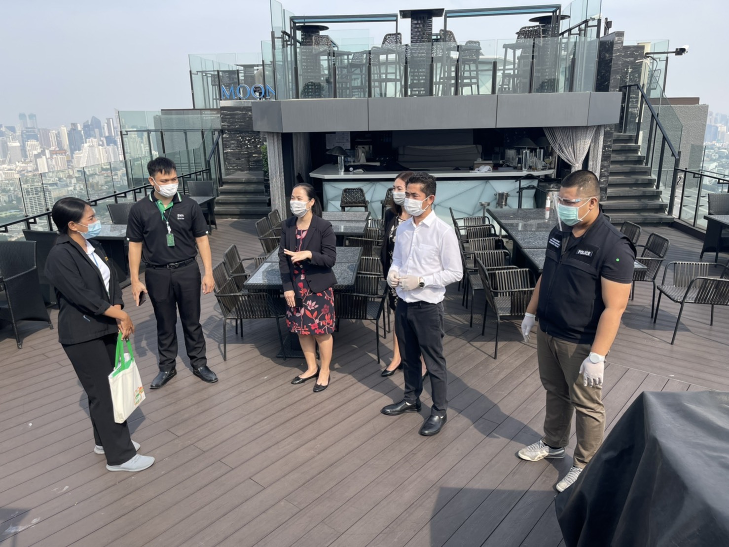 Officials inspect a rooftop restaurant at Banyan Tree Bangkok Hotel.