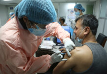 Anutin Says Vaccination Campaign Delayed Due to Supply Row A Nepalese doctor receives AstraZeneca/Oxford University vaccines, manufactured under license by Serum Institute of India at Teaching Hospital in Kathmandu, Nepal on Jan. 27, 2021. Photo: Niranjan Shrestha / AP