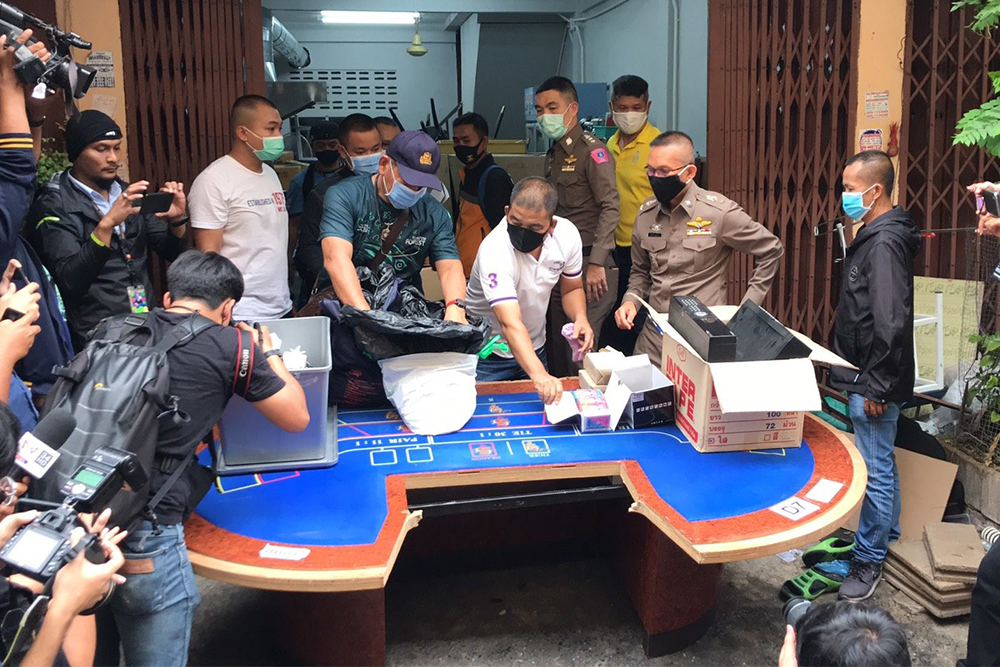 Police show a baccarat table on Aug. 10, 2020, part of a hidden stash from a gambling den in the Rama III area.