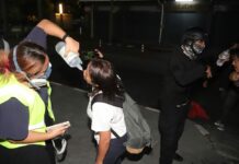 Cops Say They Don’t Use Tear Gas During Clash at Police Station Reporters and demonstrators wash their faces after feeling the effect of tear gas during a clash on Feb. 10, 2021.