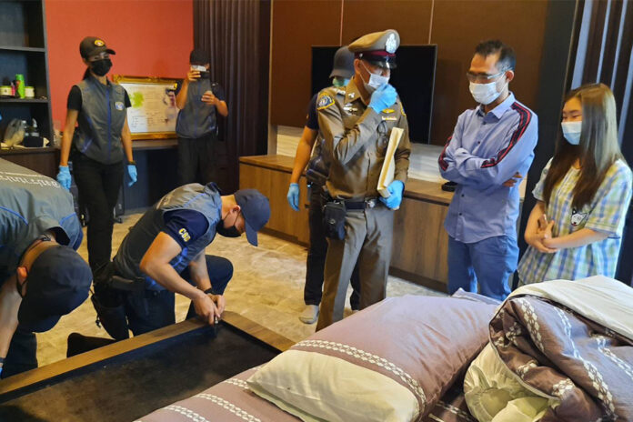 Somchai Jutikitdet, right, in blue shirt, during the police raid of his home in Rayong City on Feb. 11, 2021. Somchai Jutikitdet, right, in blue shirt, during the police raid of his home in Rayong City on Feb. 11, 2021.