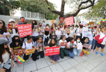 Gov’t Won’t Confirm Burmese Junta Rep’s Talks With Prayut Burmese demonstrators hold up banners during an anti-coup protest in front of the United Nations office in Bangkok on Feb. 21, 2021.