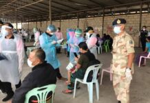 Local Gov’t, Private Hospitals Blocked From Starting Vaccine Drive Residents in Mae Sot district, Tak, queue up for coronavirus tests during an active case-finding initiative on Feb. 9, 2021.