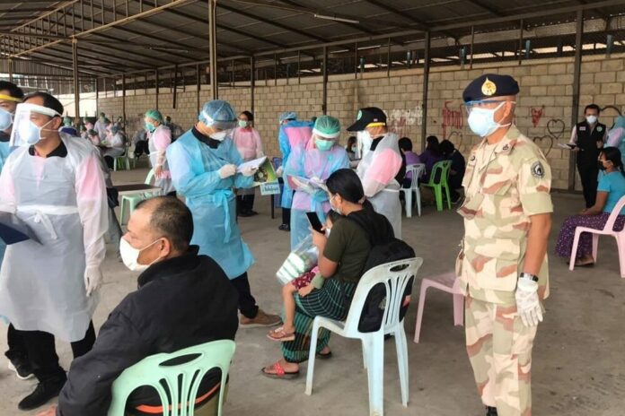 Residents in Mae Sot district, Tak, queue up for coronavirus tests during an active case-finding initiative on Feb. 9, 2021.