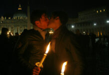 Vatican Cardinals Defend Gay Union Blessing Ban Amid Dissent FILE - In this Saturday Dec. 6, 2008 file photo two men kiss each other outside St. Peter's Square at the Vatican during a candle-lit demonstration for gay rights. Photo: Alessandra Tarantino / AP File