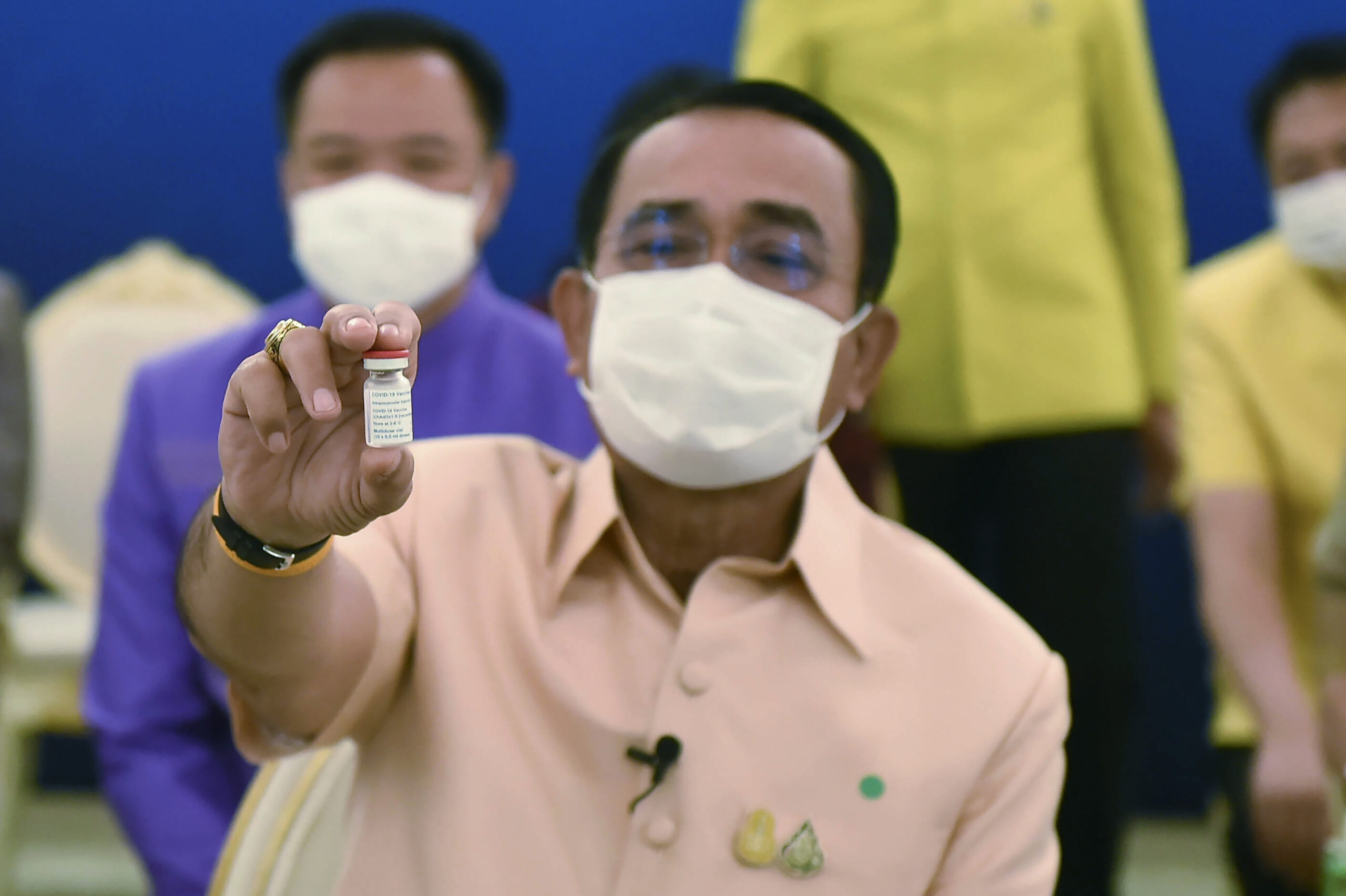 In this photo released by Government Spokesman Office, Thailand's Prime Minister Prayuth Chan-ocha holds a vial containing the AstraZeneca's COVID-19 vaccine before he receives a shot at government house in Bangkok, Thailand, Tuesday, March 16, 2021. Photo: Government Spokesman Office via AP