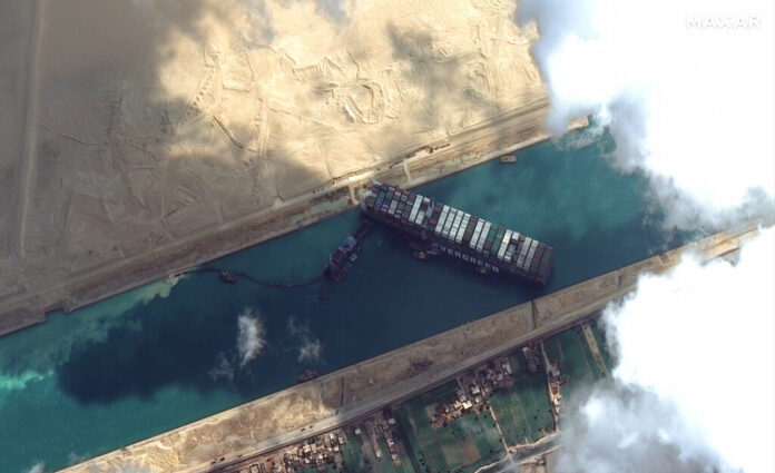 This satellite image from Maxar Technologies shows the cargo ship MV Ever Given stuck in the Suez Canal near Suez, Egypt, Friday, March 26, 2021. Photo: Maxar Technologies via AP