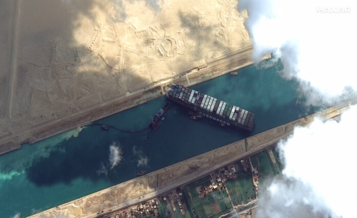 This satellite image from Maxar Technologies shows the cargo ship MV Ever Given stuck in the Suez Canal near Suez, Egypt, Friday, March 26, 2021. Photo: Maxar Technologies via AP This satellite image from Maxar Technologies shows the cargo ship MV Ever Given stuck in the Suez Canal near Suez, Egypt, Friday, March 26, 2021. Photo: Maxar Technologies via AP