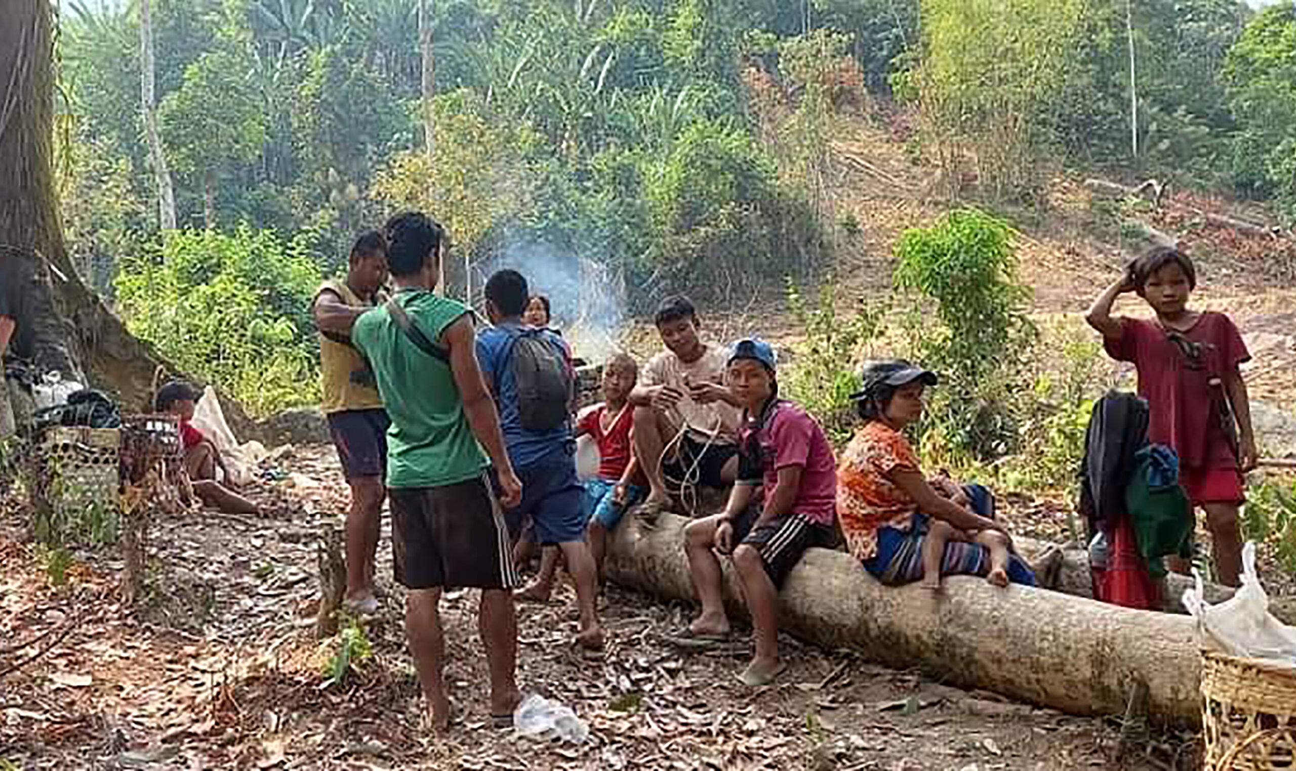 In this photo released by the Free Burma Rangers, Karen villagers gather in the forests as they hide from military airstrikes in the Deh Bu Noh area of the Papun district, north Karen state, Myanmar, Sunday, March 28, 2021. Photo: Free Burma Rangers via AP