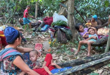 Thousands Flee Into Thailand Following Myanmar Air Strikes In this photo released by the Free Burma Rangers, Karen villagers gather in the forests as they hide from military airstrikes in the Deh Bu Noh area of the Papun district, north Karen state, Myanmar, Sunday, March 28, 2021. Photo: Free Burma Rangers via AP
