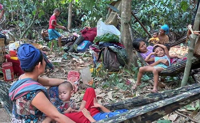 In this photo released by the Free Burma Rangers, Karen villagers gather in the forests as they hide from military airstrikes in the Deh Bu Noh area of the Papun district, north Karen state, Myanmar, Sunday, March 28, 2021. Photo: Free Burma Rangers via AP