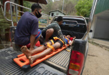 Thailand Denies Forcing Fleeing Villagers Back To Myanmar An injured Karen villager from Myanmar is transported at Ban Mae Sam Laep Health Center, Mae Hong Son province, northern Thailand, after crossing Salawin river on a boat, on Tuesday March 30, 2021. Photo: Sakchai Lalit / AP