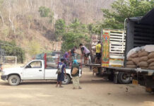 Prayut Denies Thailand Sending Rice to Myanmar Army In this undated photo, a group of unidentified individuals load what appeared to be rice sacks to a truck at the Thai-Myanmar border in Mae Hong Son province.
