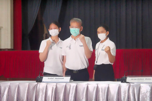 Gov. Veerasak Vijitsaengsri and his family pose during a news conference at Siriraj Hospital on Mar. 19, 2021.