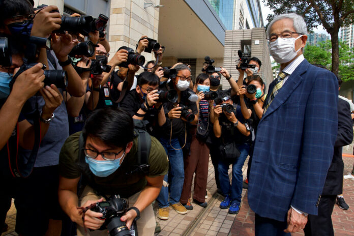 Pro-democracy lawmaker Martin Lee, right, arrives at a court in Hong Kong Thursday, April 1, 2021. Photo: Vincent Yu / AP Pro-democracy lawmaker Martin Lee, right, arrives at a court in Hong Kong Thursday, April 1, 2021. Photo: Vincent Yu / AP