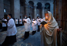 Hymns Through Masks: Christians Mark Another Pandemic Easter Priests circle the Edicule during Easter Sunday Mass led by the Latin Patriarch at the Church of the Holy Sepulchre, where many Christians believe Jesus was crucified, buried and rose from the dead, in the Old City of Jerusalem, Sunday, April 4, 2021. Photo: Oded Balilty / AP