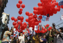 Myanmar’s Online Pop-up Markets Raise Funds for Protest FILE - In this March 22, 2021, file photo, anti-coup protesters release red balloons with notes calling for foreign intervention to help them in Yangon, Myanmar. Photo: AP File