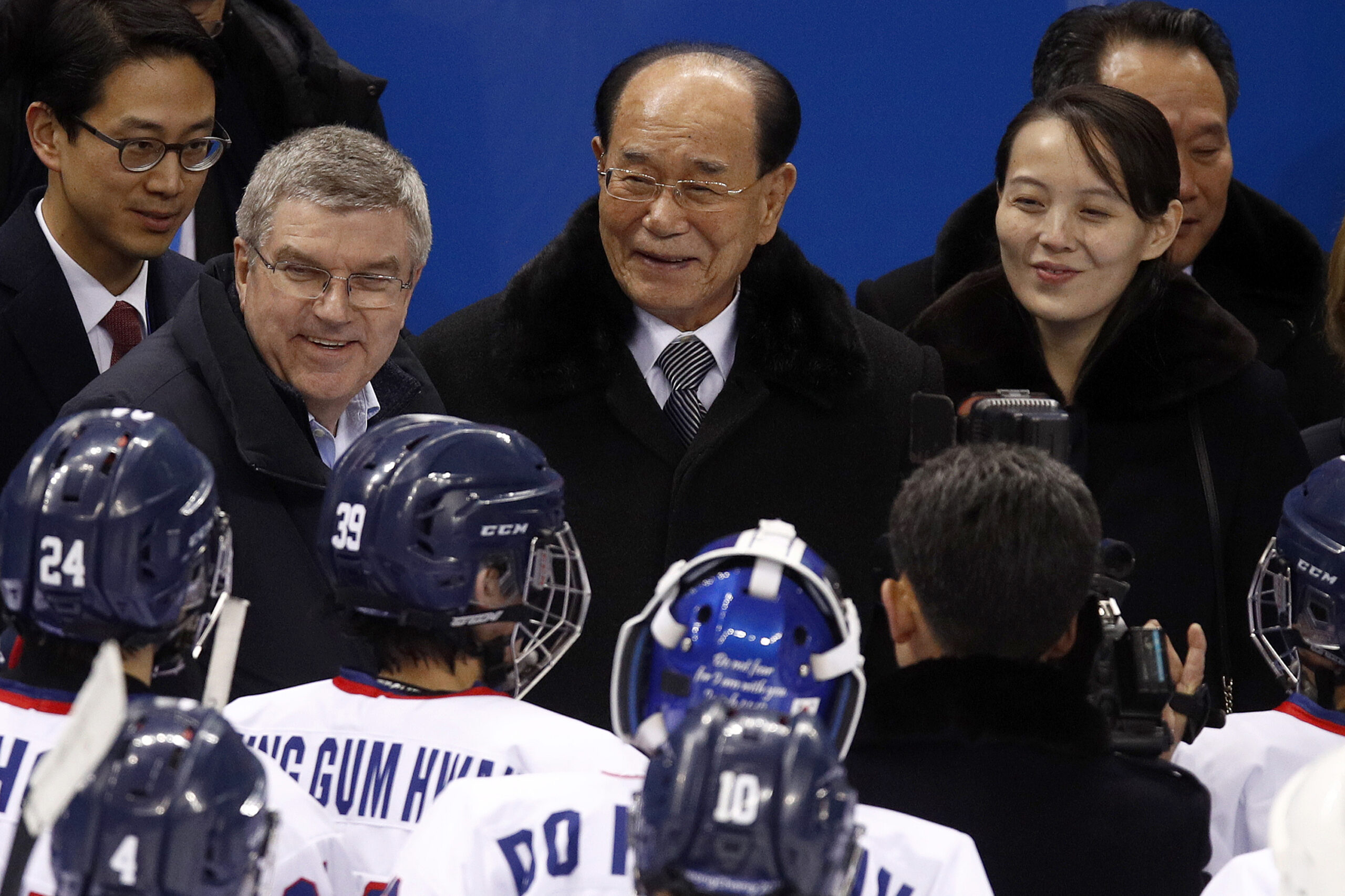 FILE - In this Feb. 10, 2018, file photo, IOC president Thomas Bach, second from left, and Kim Yo Jong, right, sister of North Korean leader Kim Jong Un, talks with players after the preliminary round of the women's hockey game between Switzerland and the combined Koreas at the 2018 Winter Olympics in Gangneung, South Korea. Photo: Jae C. Hong / AP File