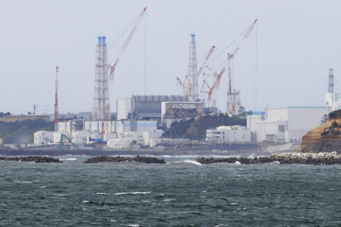 Fukushima Daiichi nuclear power plant is seen from Namie town, Fukushima prefecture, north of Tokyo, Tuesday, April 13, 2021. Photo: Yusuke Ogata / Kyodo News via AP
