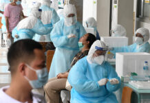 Opinion: Try Not to Mix Politics With the Outbreak A woman takes a coronavirus test at Bangkok Youth Center on Apr. 17, 2021.