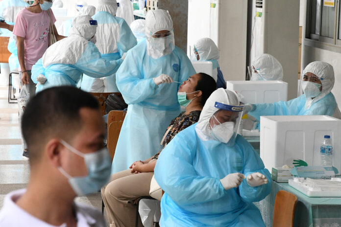A woman takes a coronavirus test at Bangkok Youth Center on Apr. 17, 2021.